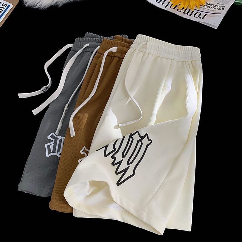 Kimeya - Sweatshorts met trekkoord en letterprint
