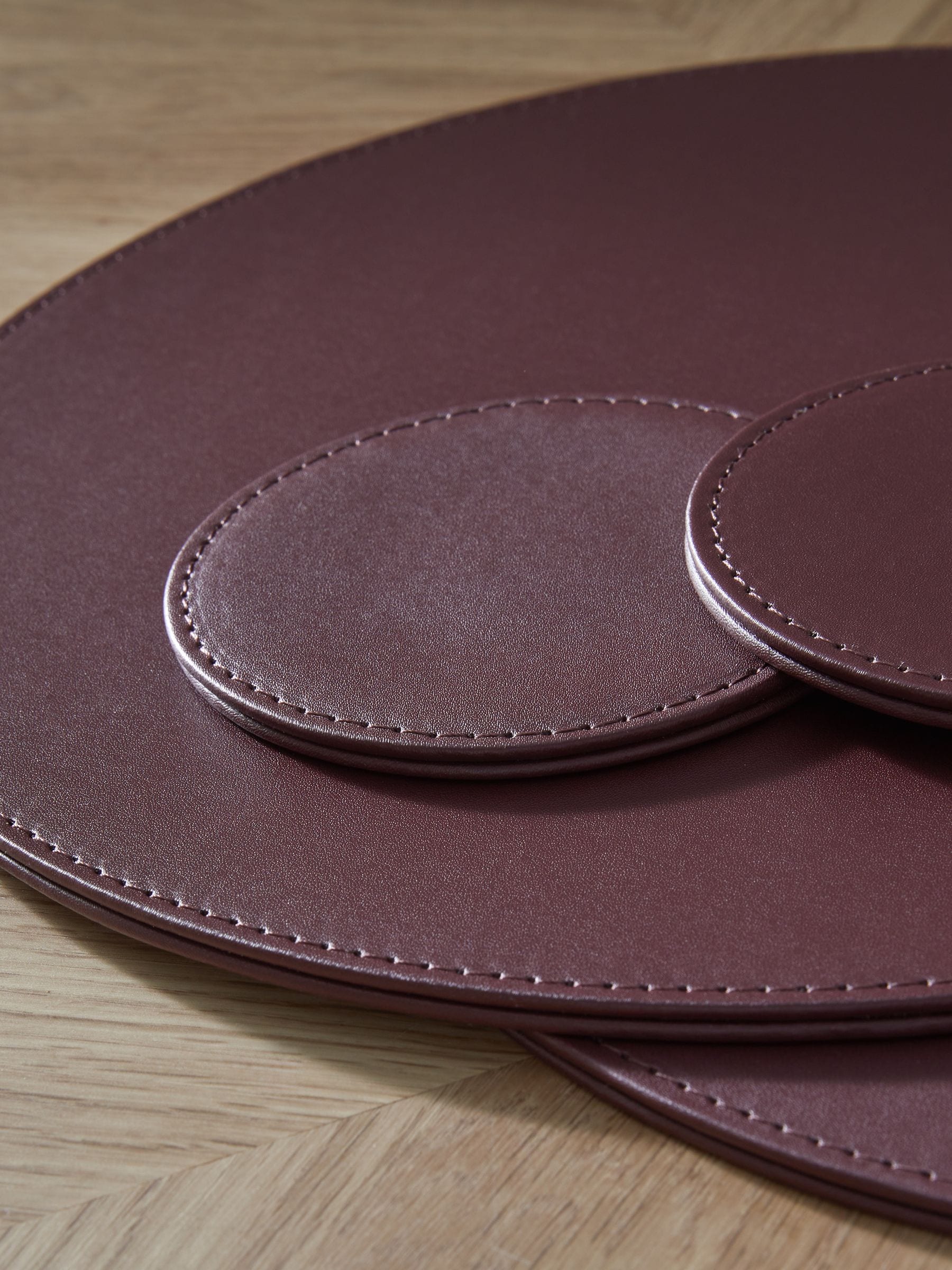 Set van 4 omkeerbare placemats en onderzetters van imitatieleer