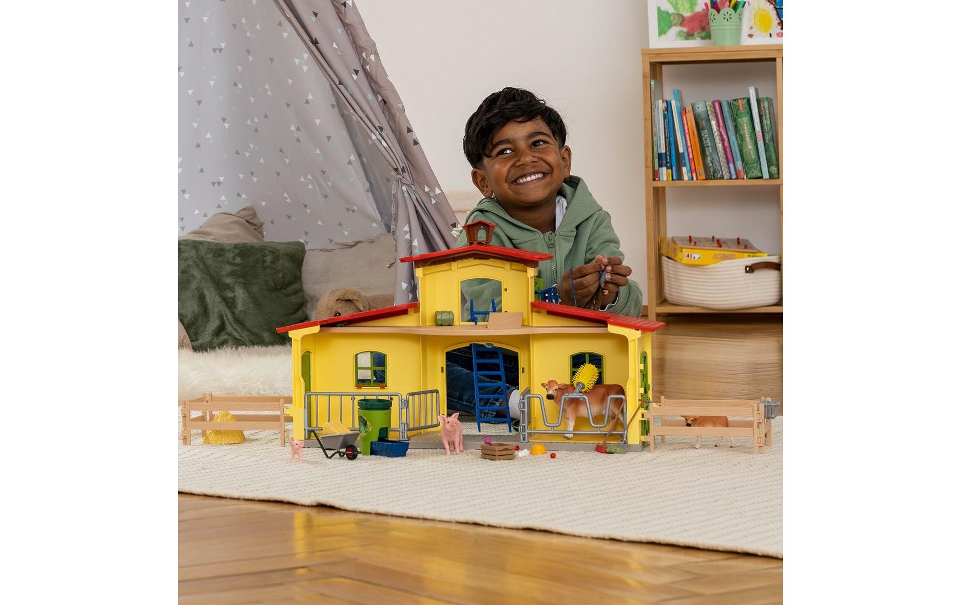 Spielfigurenset Farm World Stall mit Tieren und ZubehörBauernhof-Spielset