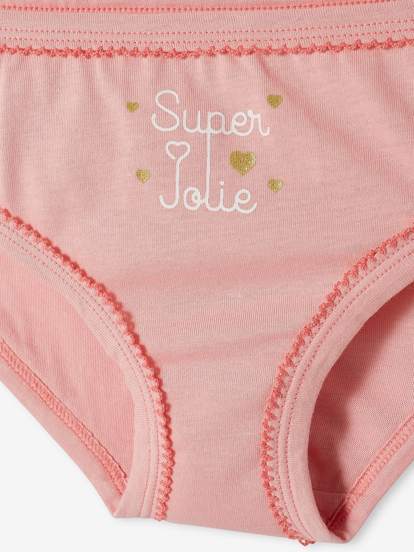 Pacote com 7 calcinhas lisas brancas para meninas com estampas.