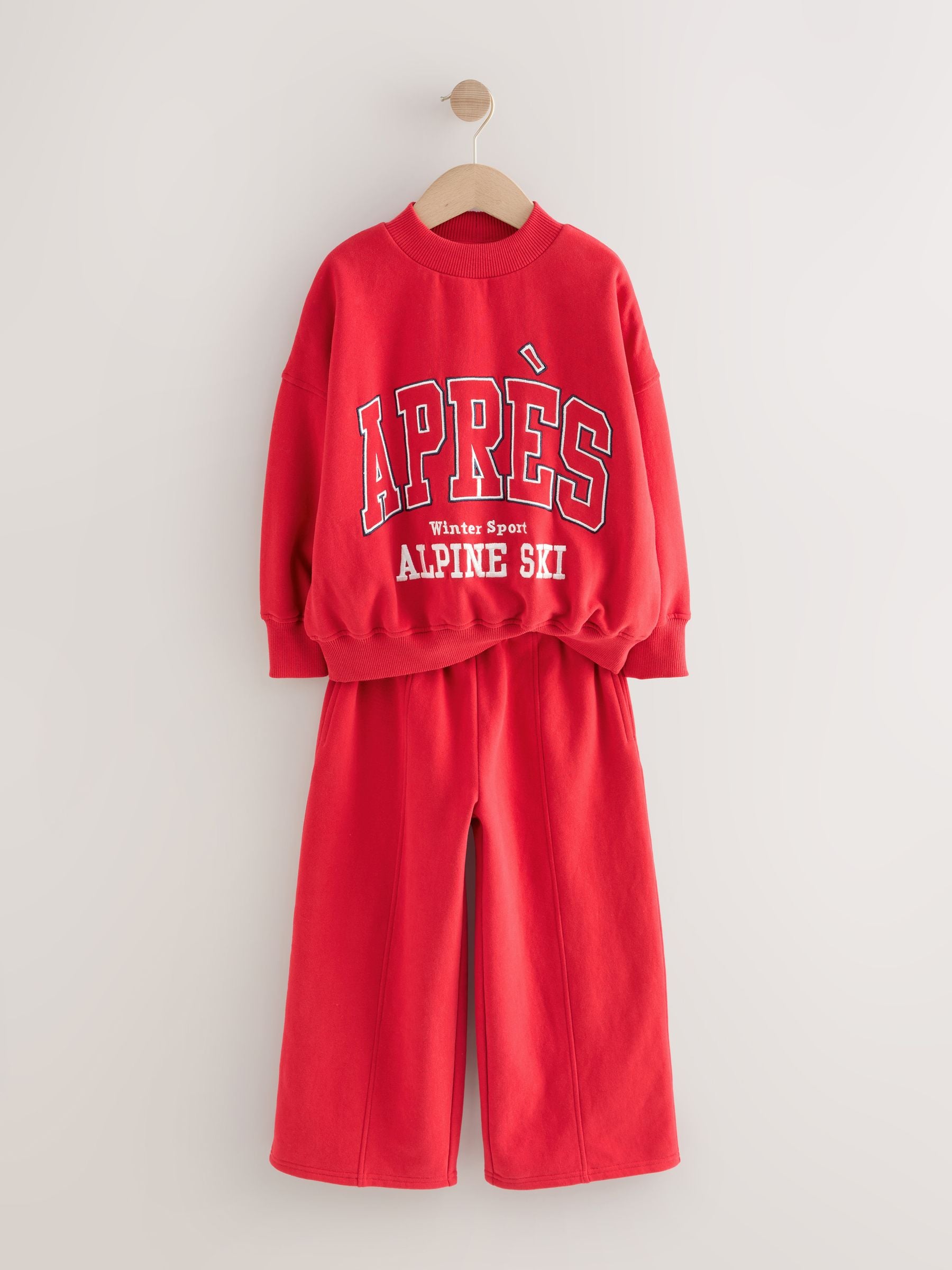 Rood met slogan - Set van sweatshirt en joggingbroek met wijde pijpen (3-16jr)