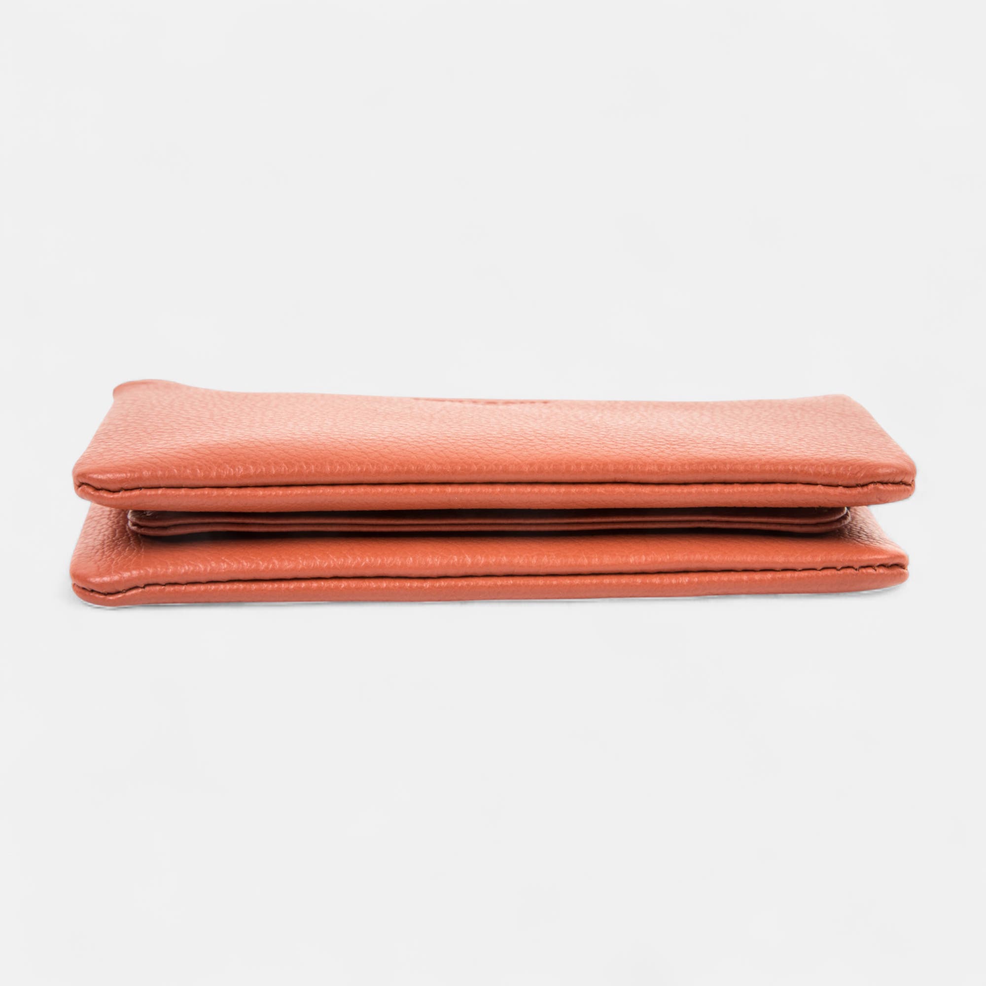 Petite maroquinerie en cuir orange