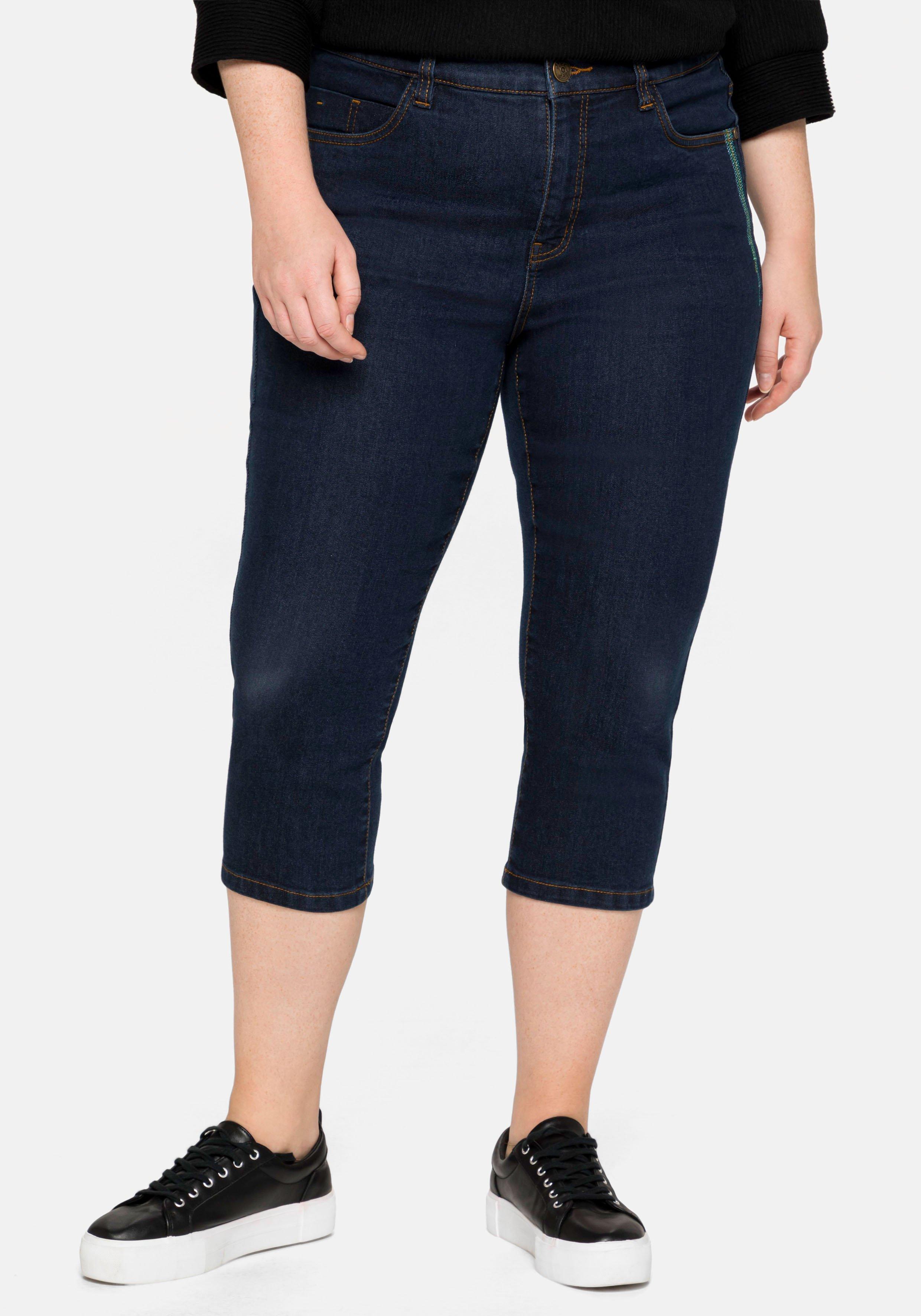 Caprijeans mit Catfaces und Kontrastnähten