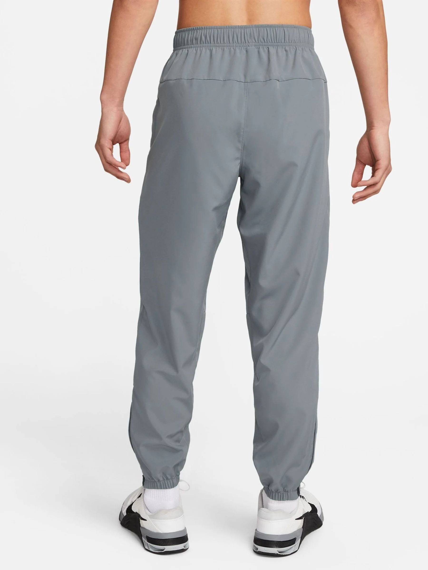 Rookgrijs - Nike Dri-FIT Form trainingsbroek met taps toelopende pijpen