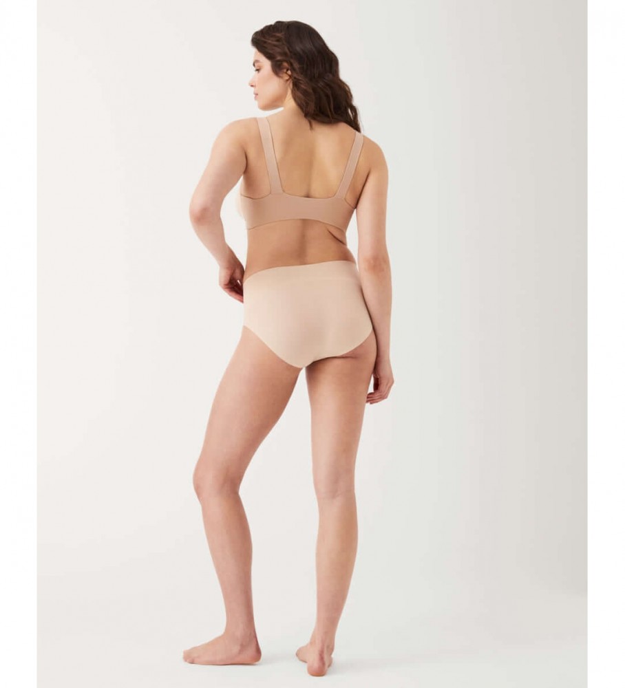 Calcinha modeladora sem costura de cintura alta SPANX na cor nude.