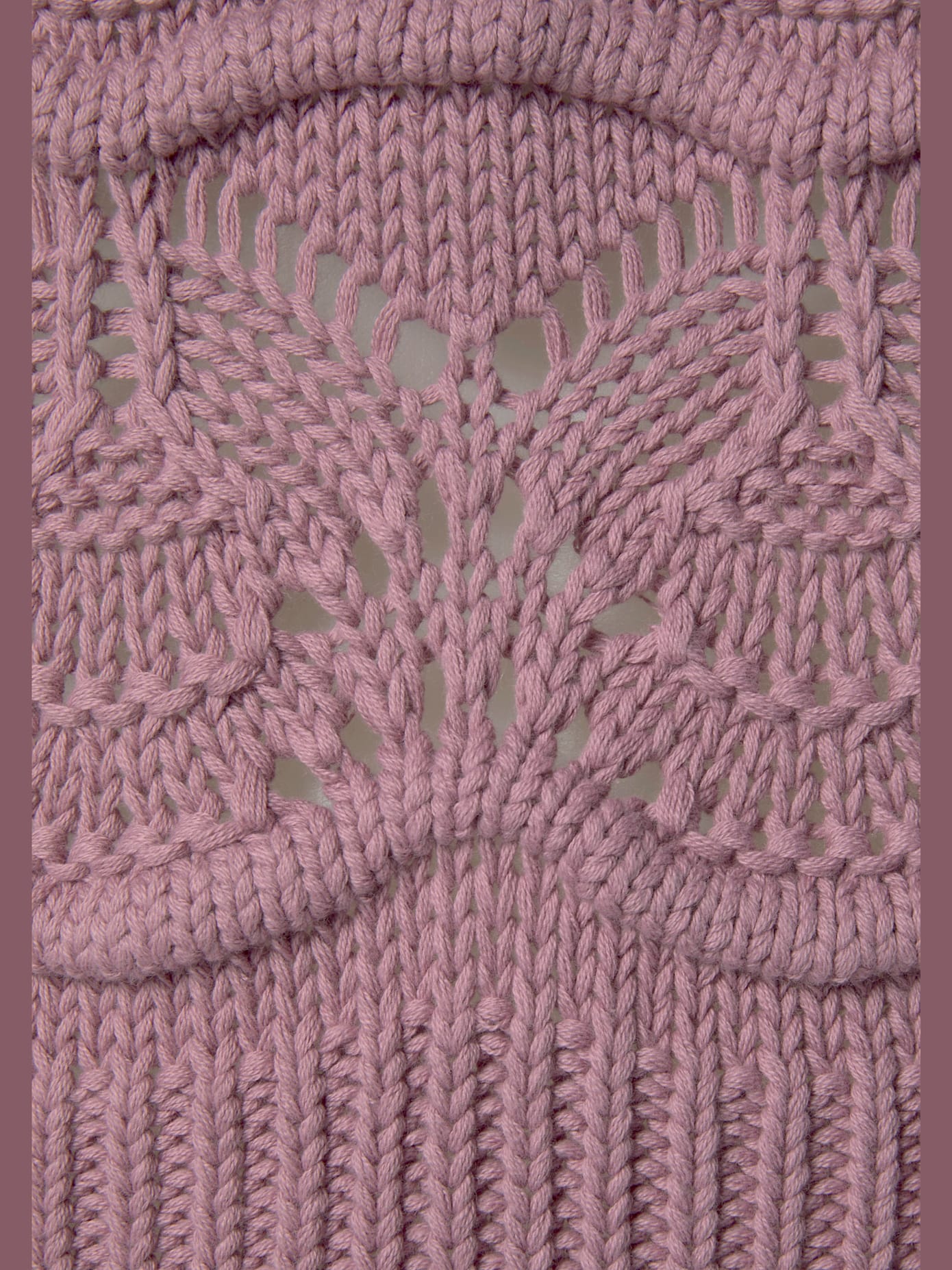 Pull col roulé en tricot ajouré