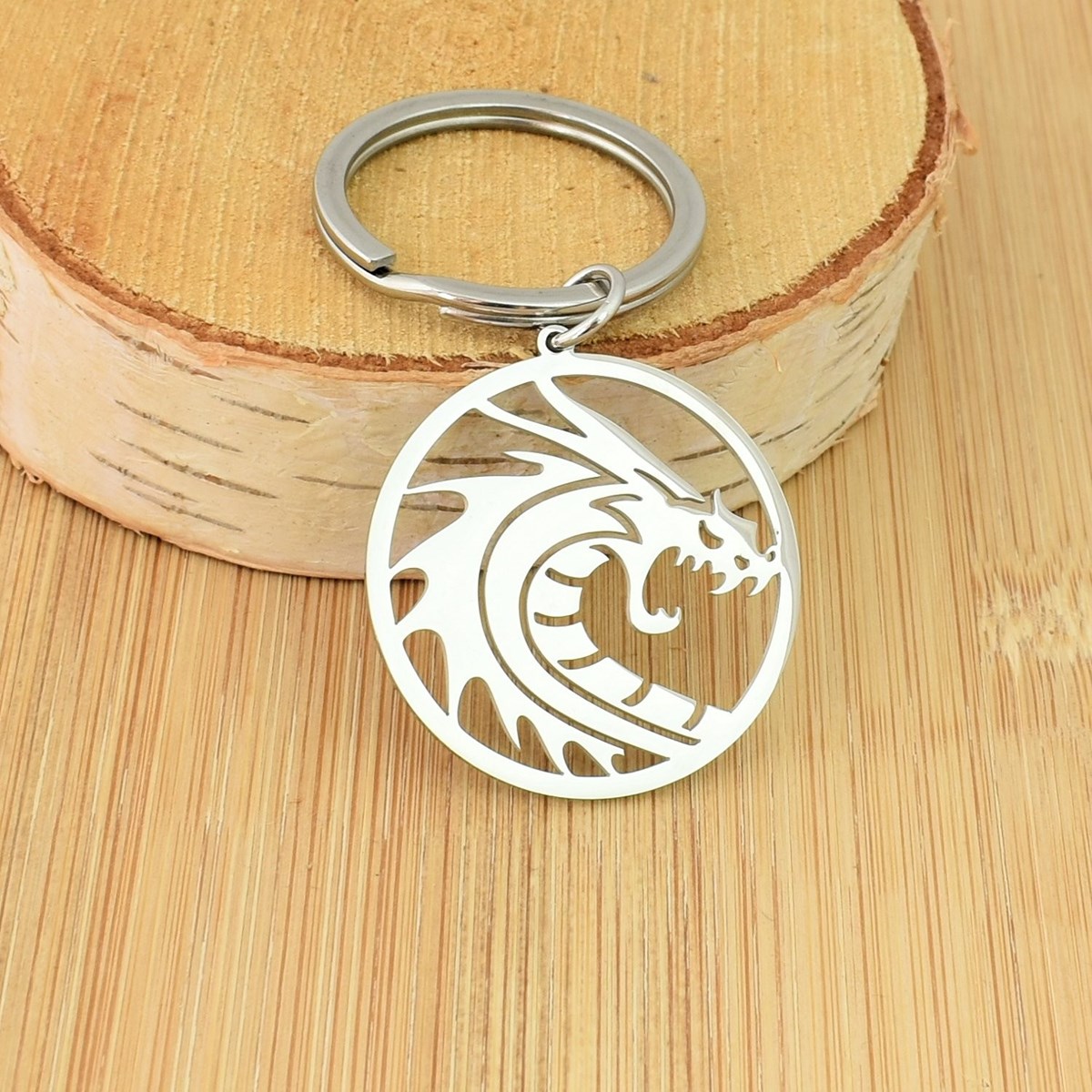 Porte-clés dragon dans un cercle acier inoxydable