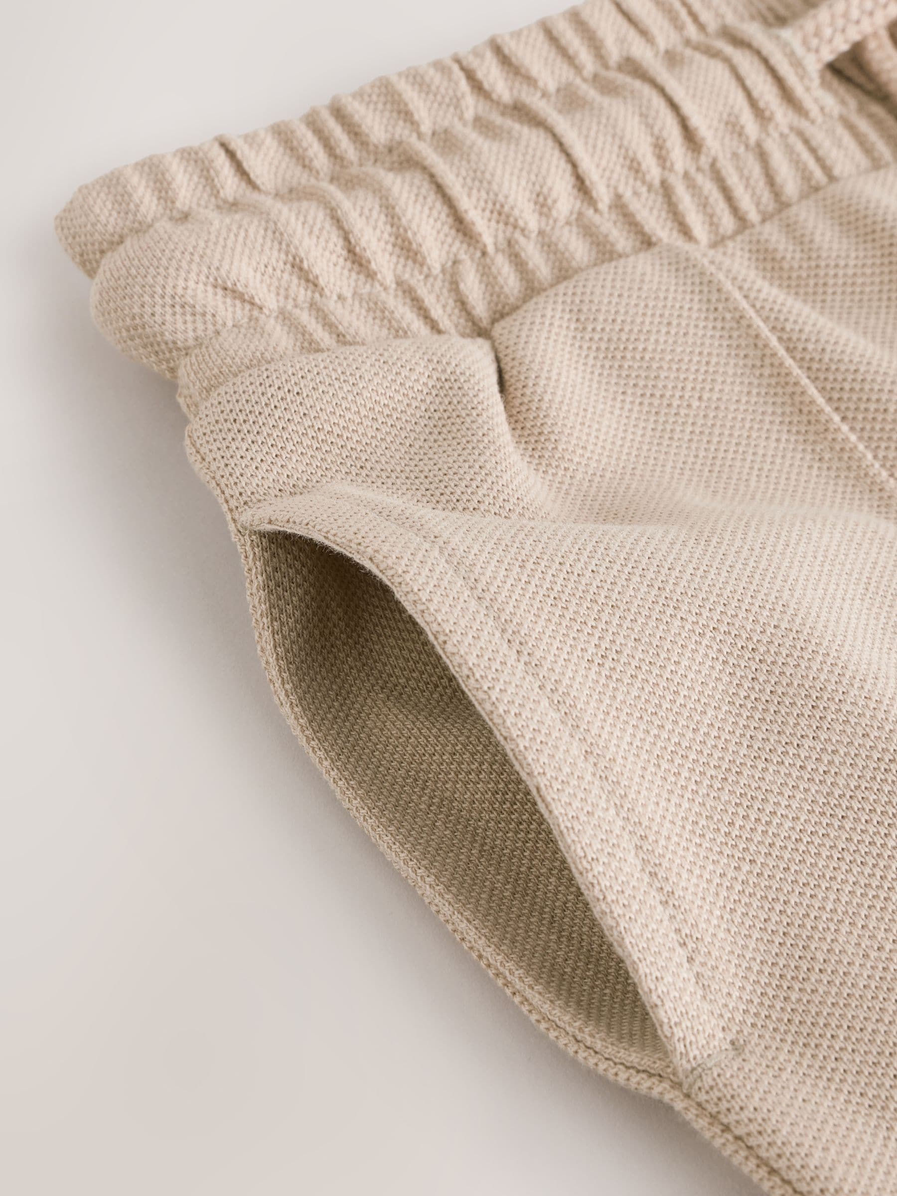 Pastelgeel - Pintuck joggingbroek van 100% katoen (3mnds-7jr)