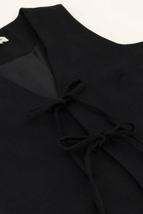 Zwart gilet met strikjes
