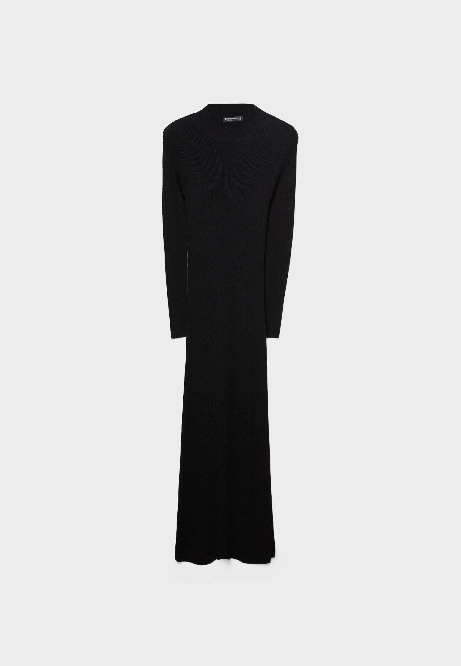 Vestido longo de tricô com laço nas costas.