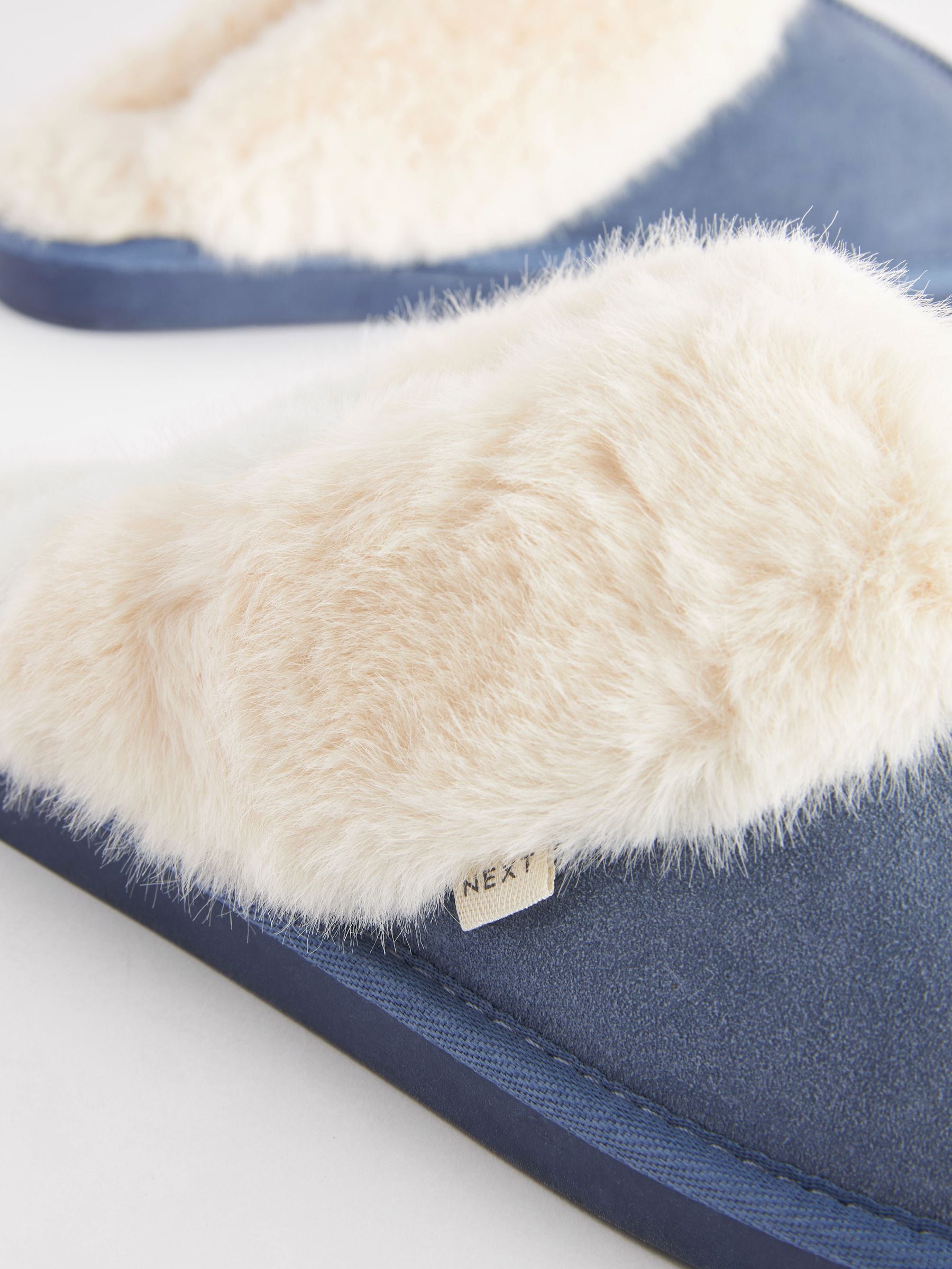 Denimblauw - Suède muiltjes met voering van imitatiebont
