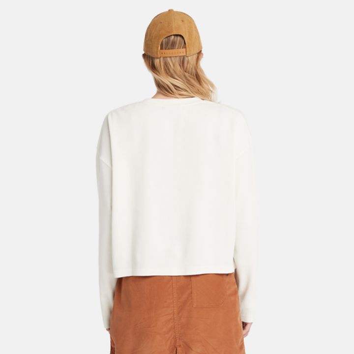 Camiseta feminina de manga comprida com textura waffle na cor branca.