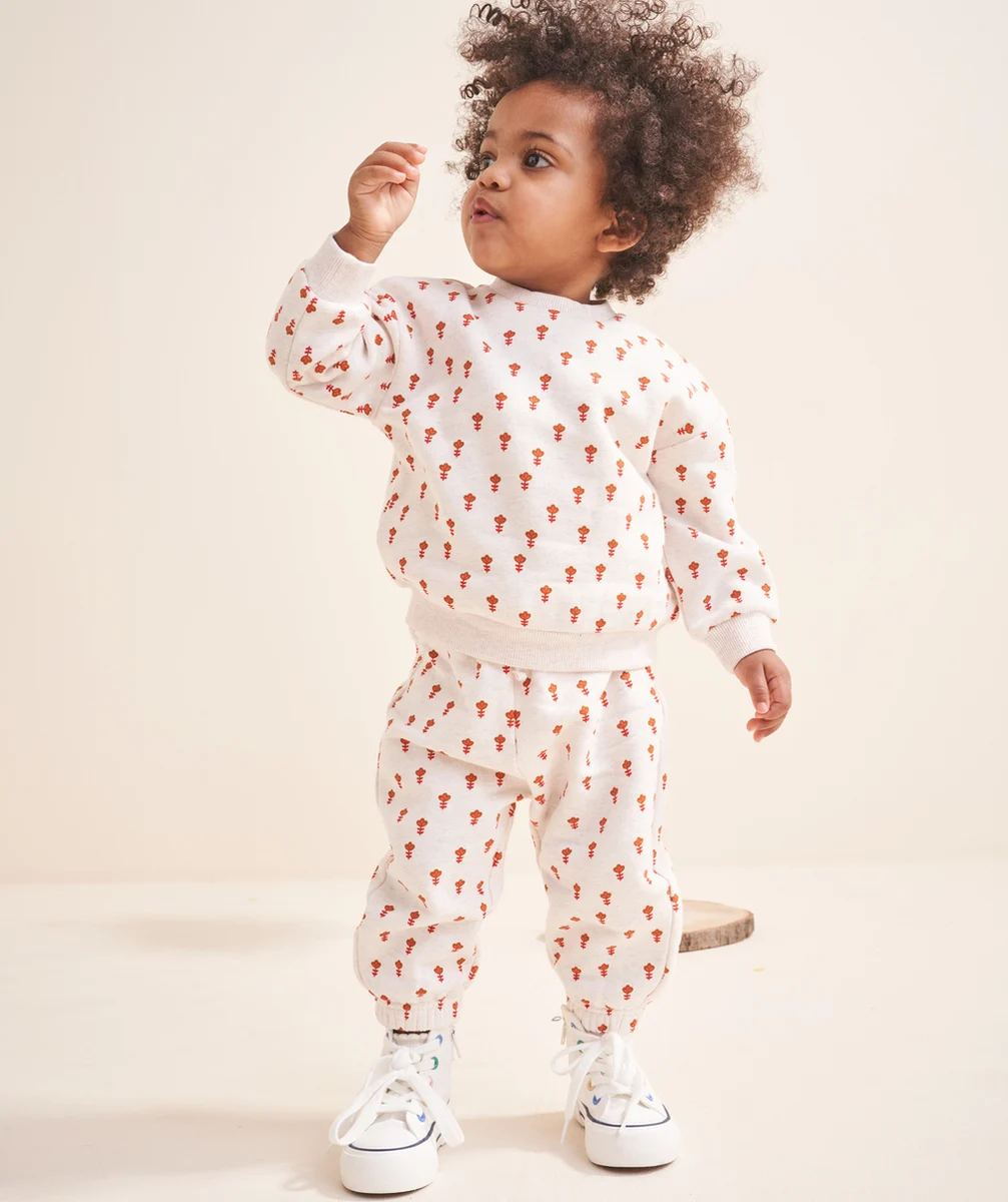 JOGGING BÉBÉ FILLE EN FIBRES RECYCLÉES ÉCRU CHINÉ IMPRIMÉ FLEURI ORANGE