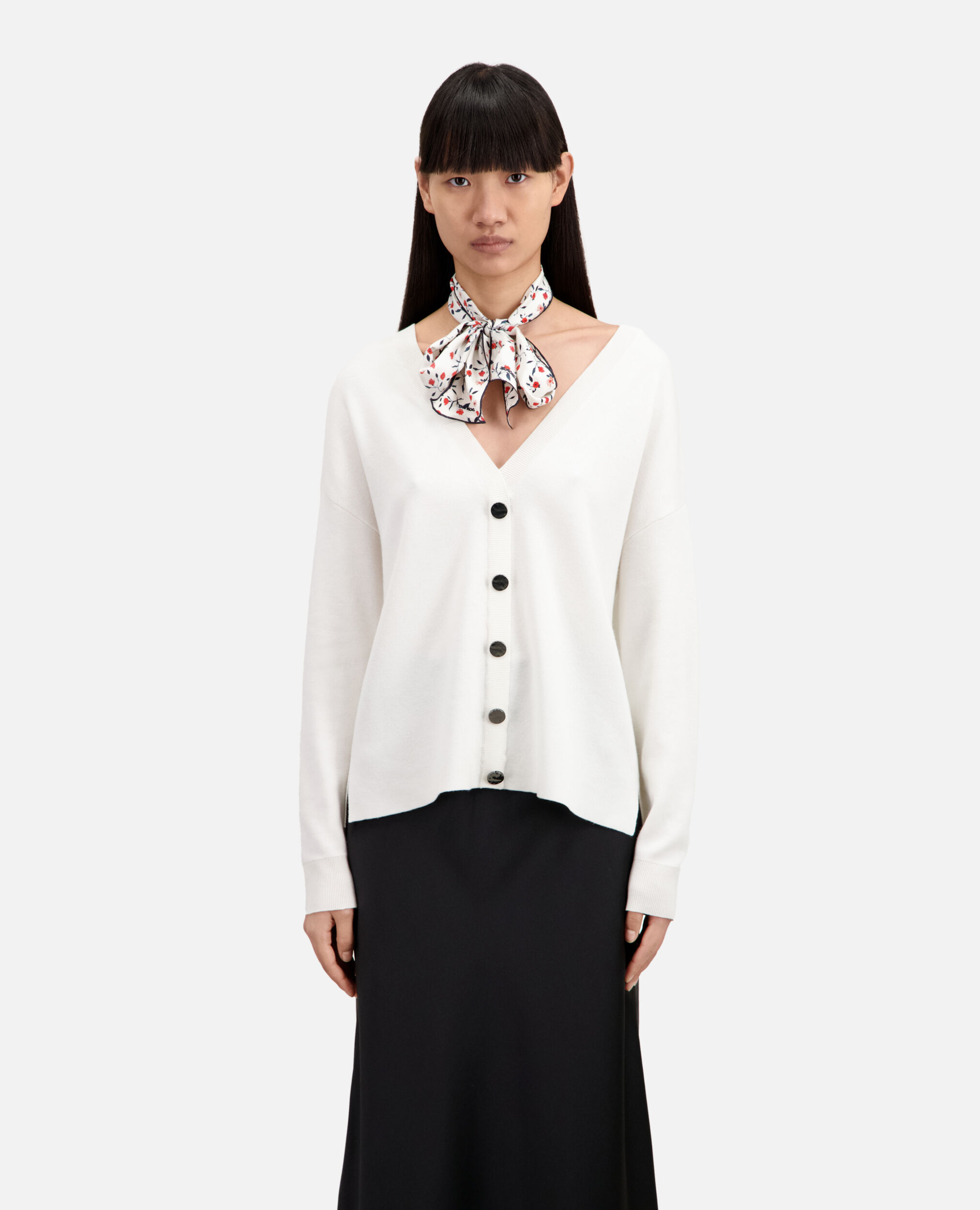 Ecru sweater with buttoning on the back