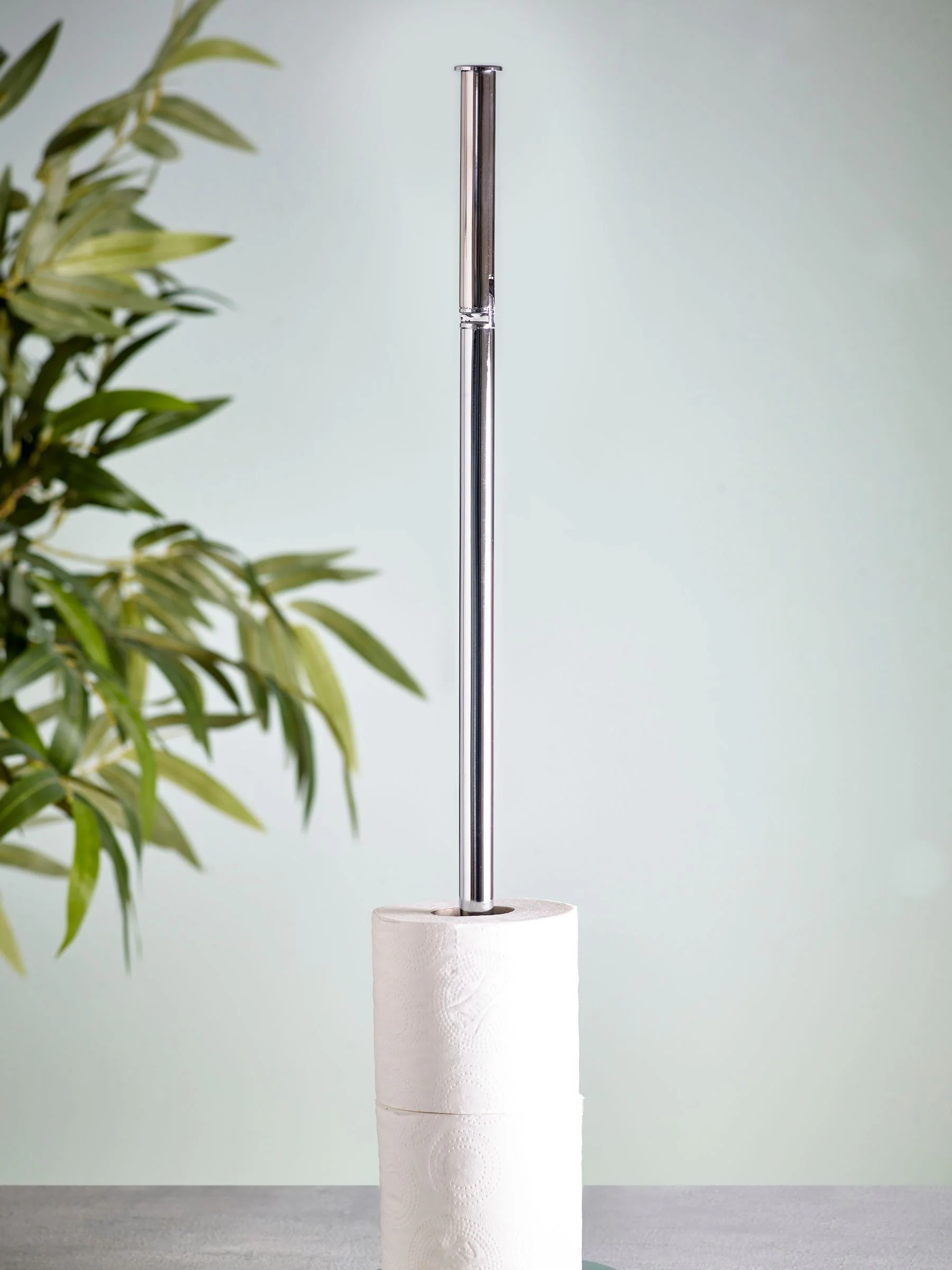 Toiletrolhouder met roterende bovenkant