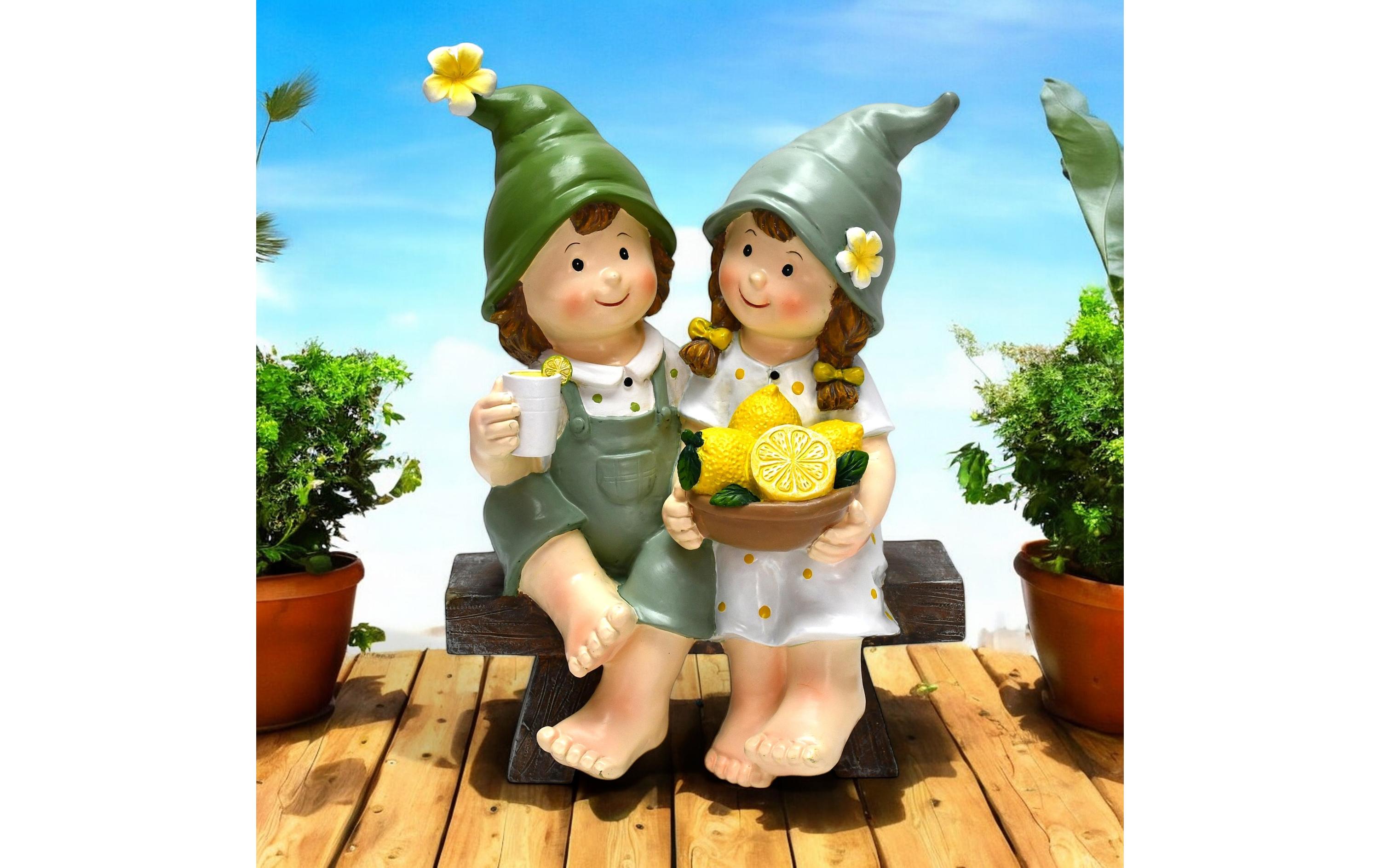 Dekofigur Kinder auf Bank sitzendGartendekoration
