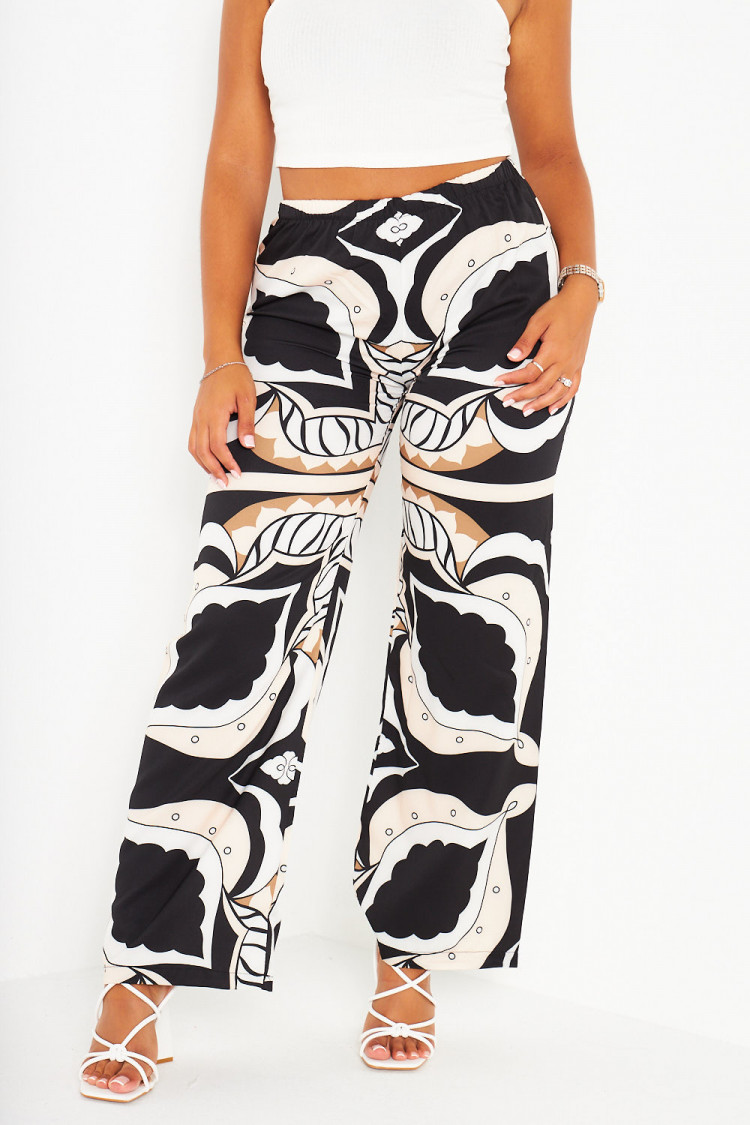 Pantalon beige large et baroque