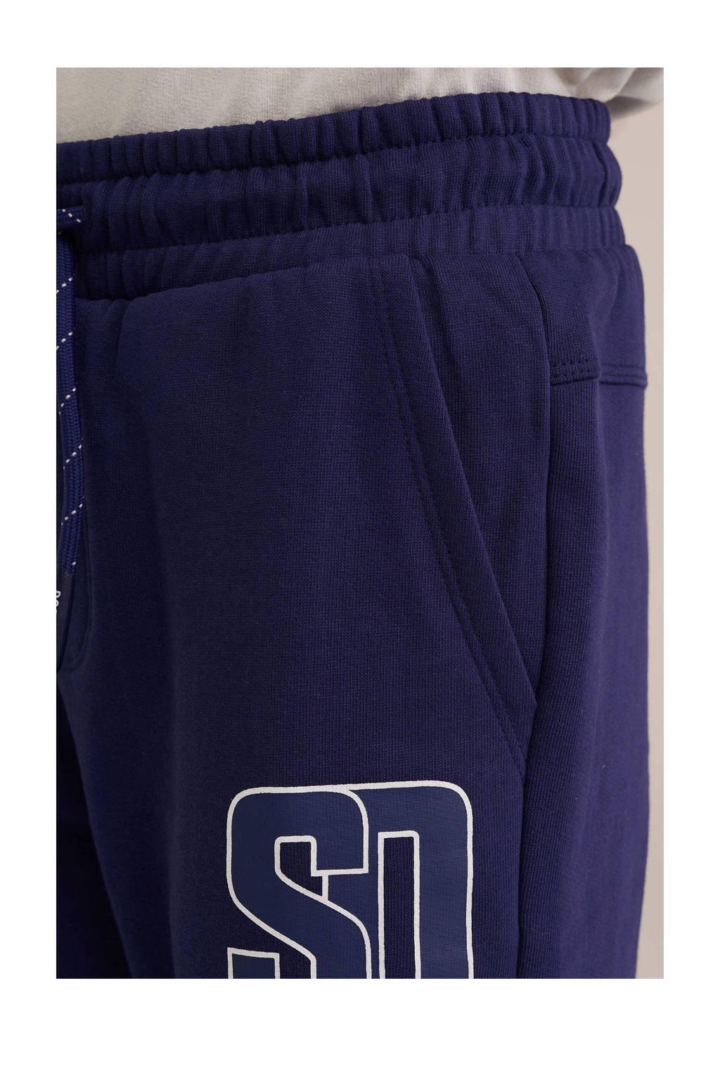WE Fashion slim fit joggingbroek met printopdruk donkerblauw