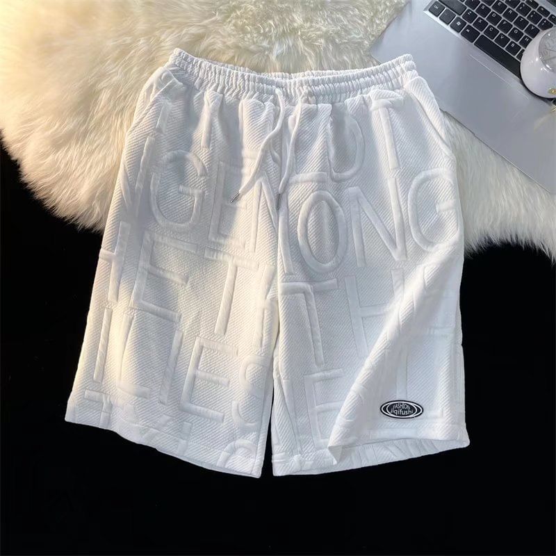 Acrius - Wijde joggingbroek met trekkoord en reliëfletters