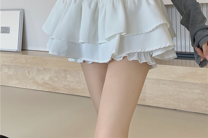 Miss Kekeli - Hoge taille, effen, geplooide mini-A-lijn rok