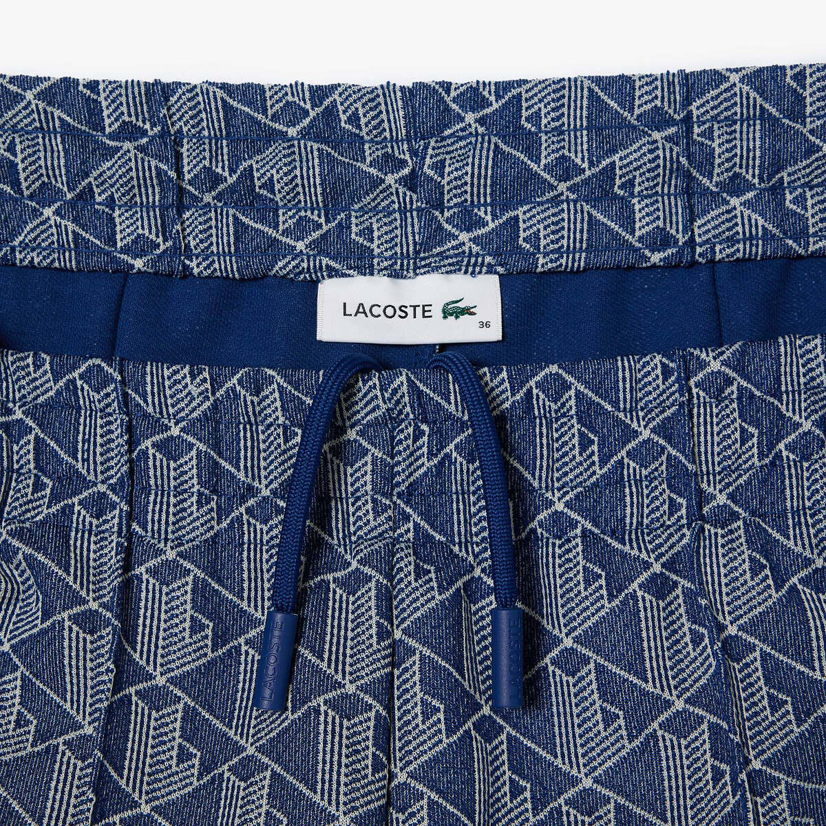 LACOSTE<br>Calças de treino com bandeira