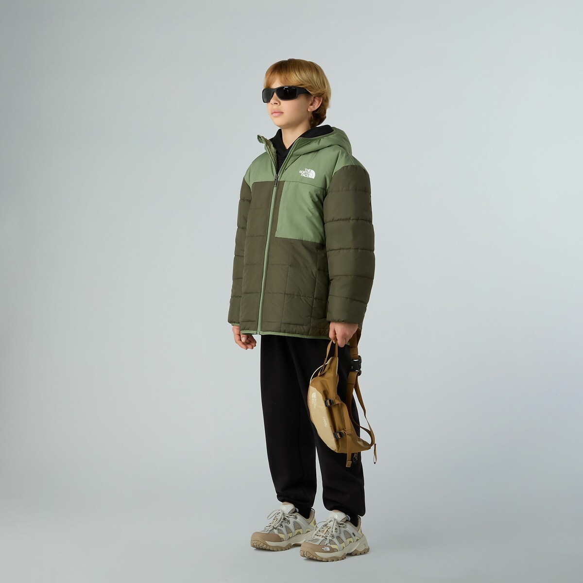 THE NORTH FACE<br>Jaqueta reversível, lado em sherpa, lado em plumas