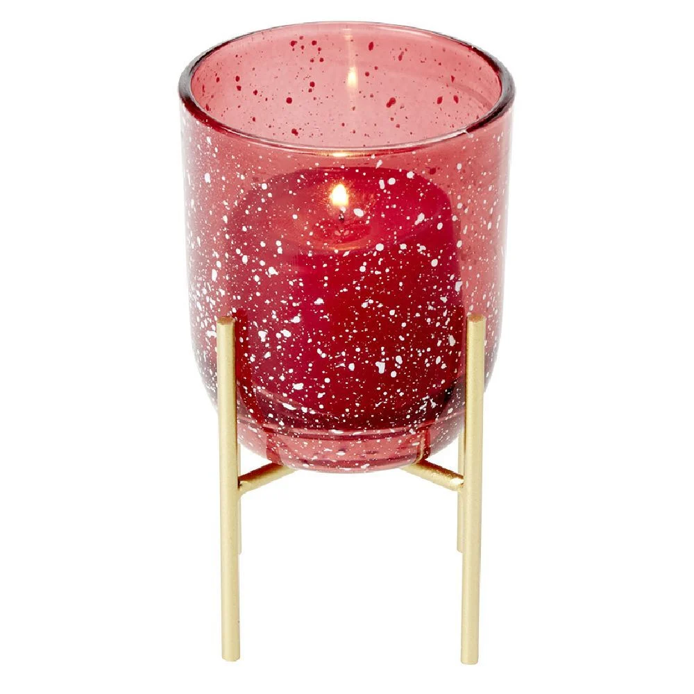 Bougeoir en verre rouge sur pied en métal doré