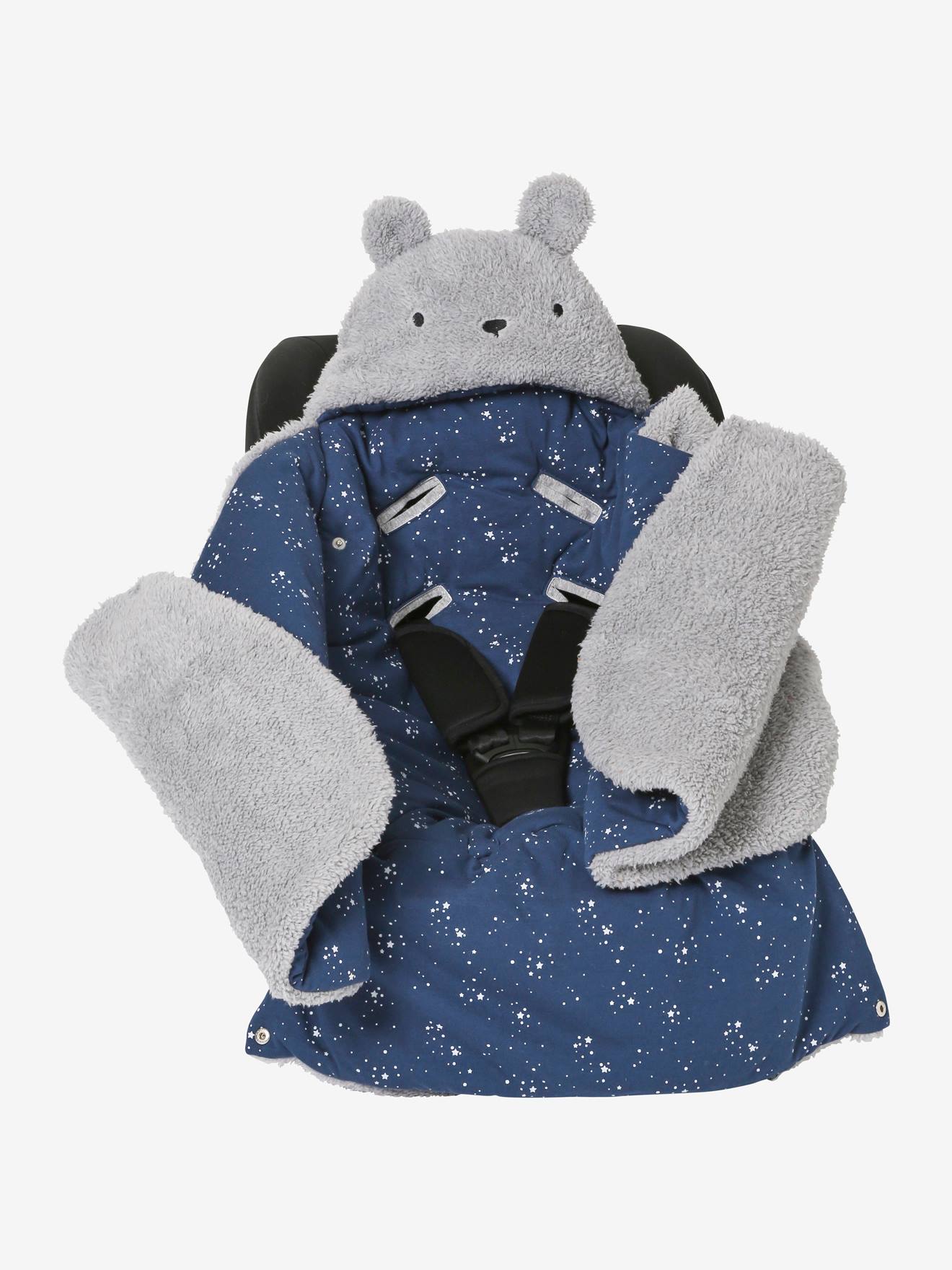 Saco transformável em brinquedo de pelúcia. Urso de pelúcia liso bege claro com estampas.