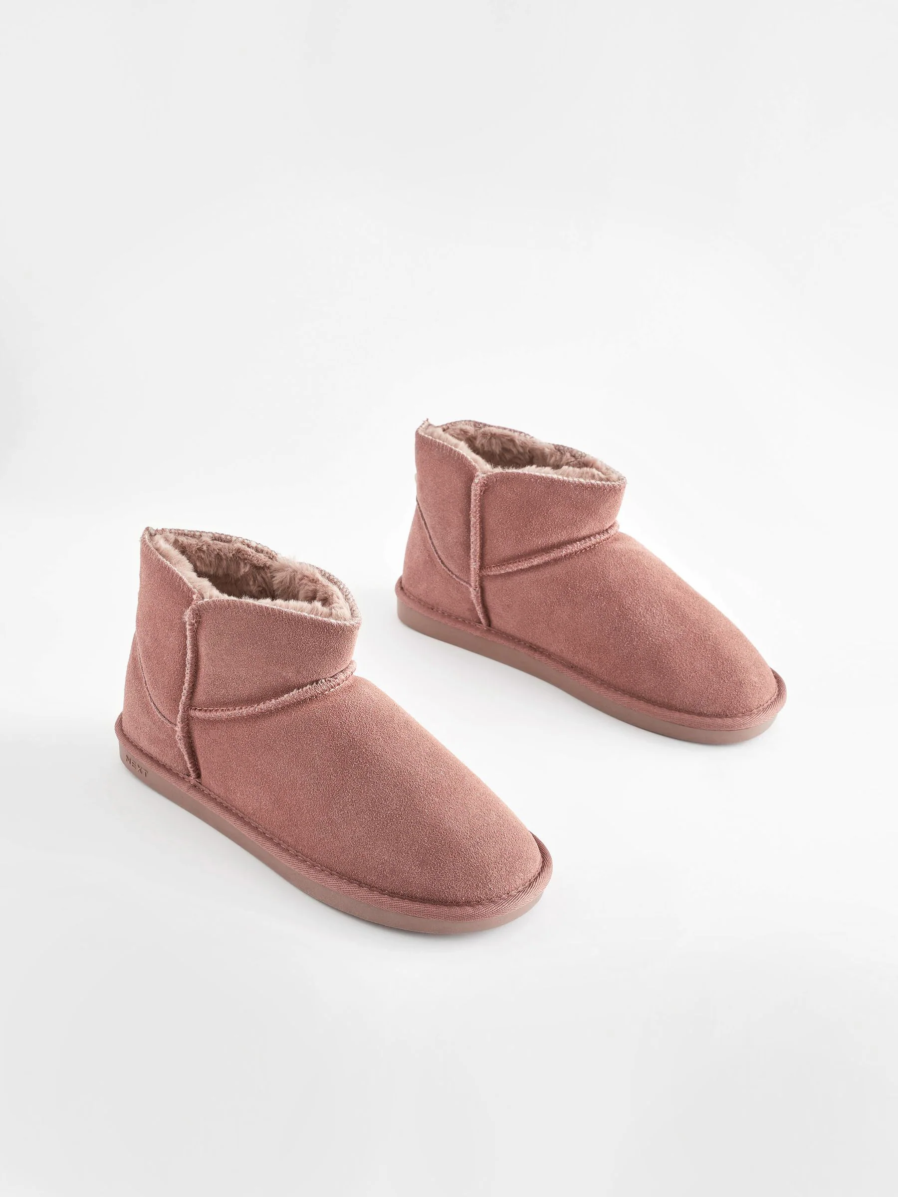 Mink roze - Suède pantoffellaarsjes met voering van imitatiebont