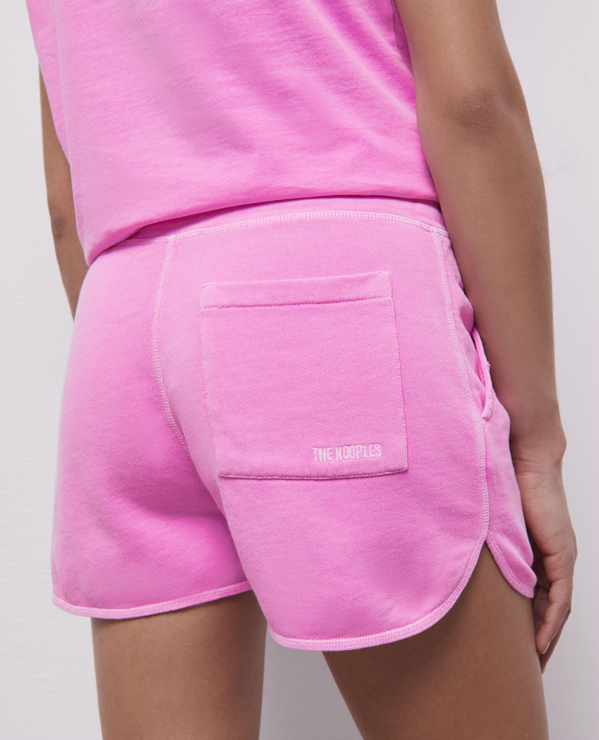 Short rose fluo en molleton avec logo