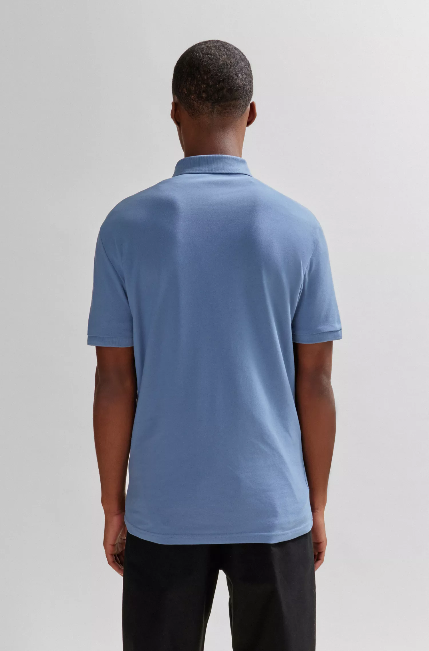 Camisa polo BOSS laranja, de algodão stretch, corte slim, com etiqueta de logotipo.