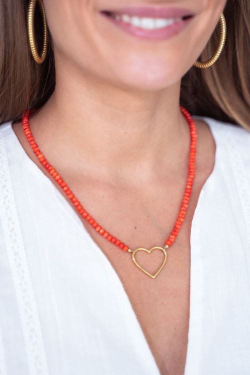 Oranje kralen ketting met hart