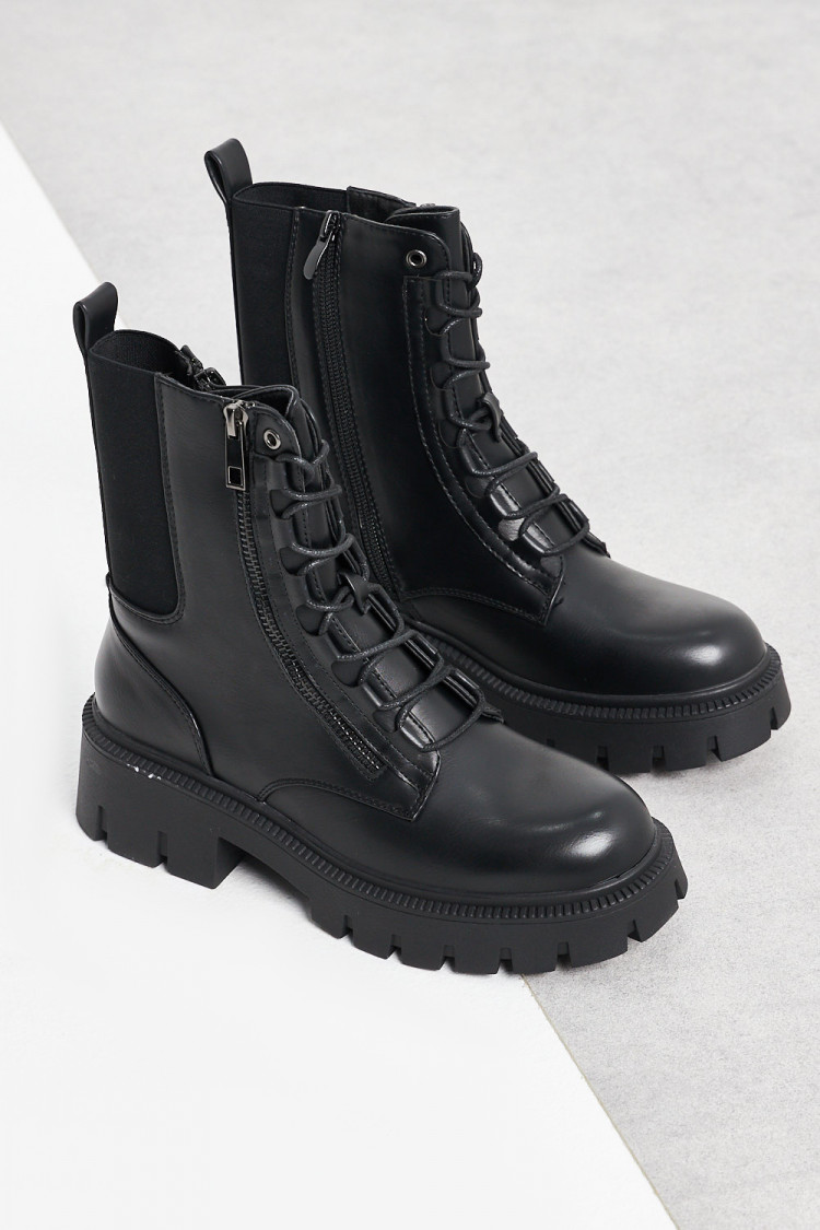 Bottines noires à empiècement bi-matière sur le côté et zip
