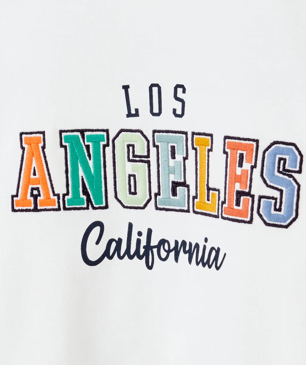 T-SHIRT GARÇON EN COTON BIO BLANC AVEC MESSAGE LOS ANGELES COLORÉ