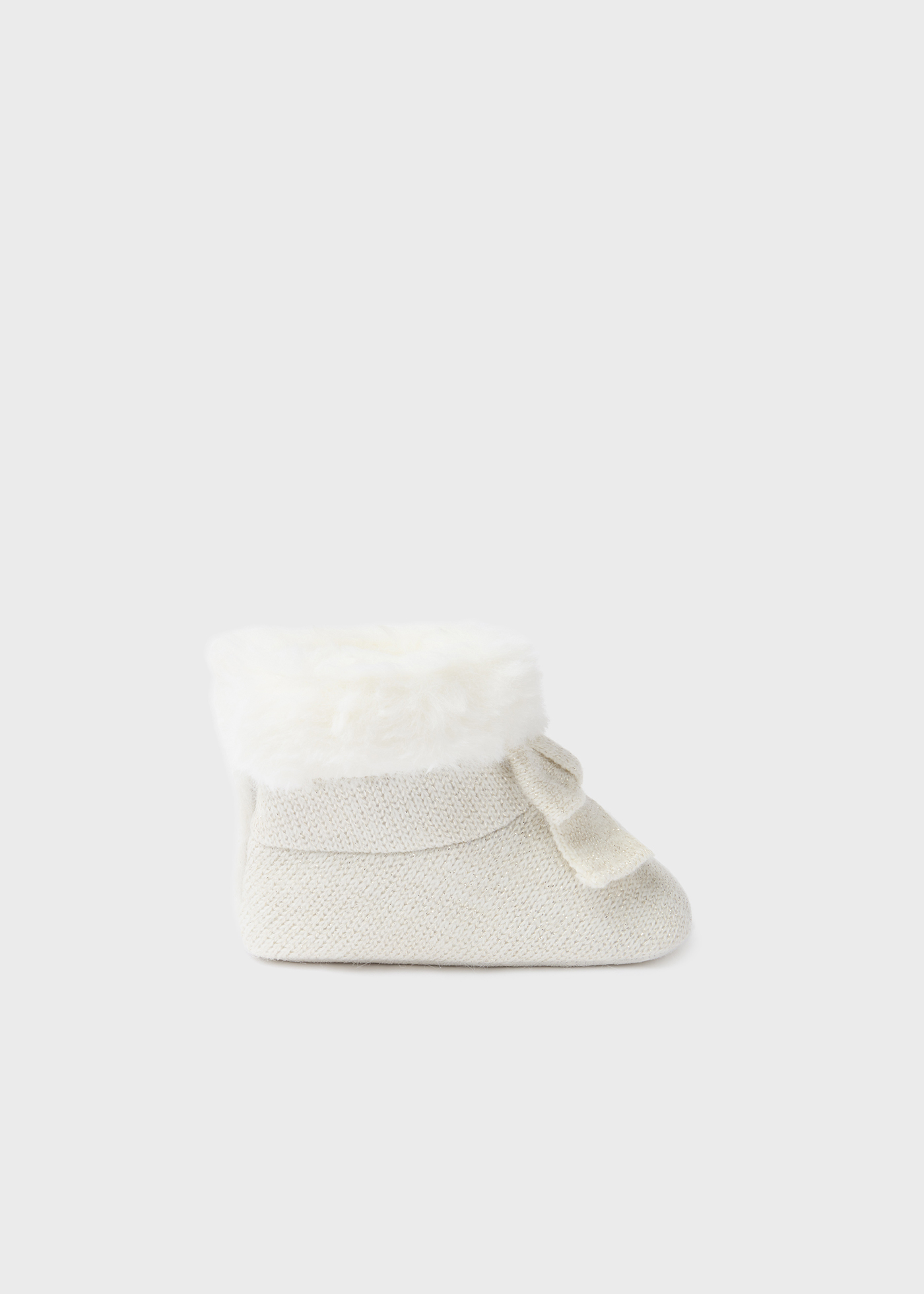 Bota de tricô com pelo de recém-nascido