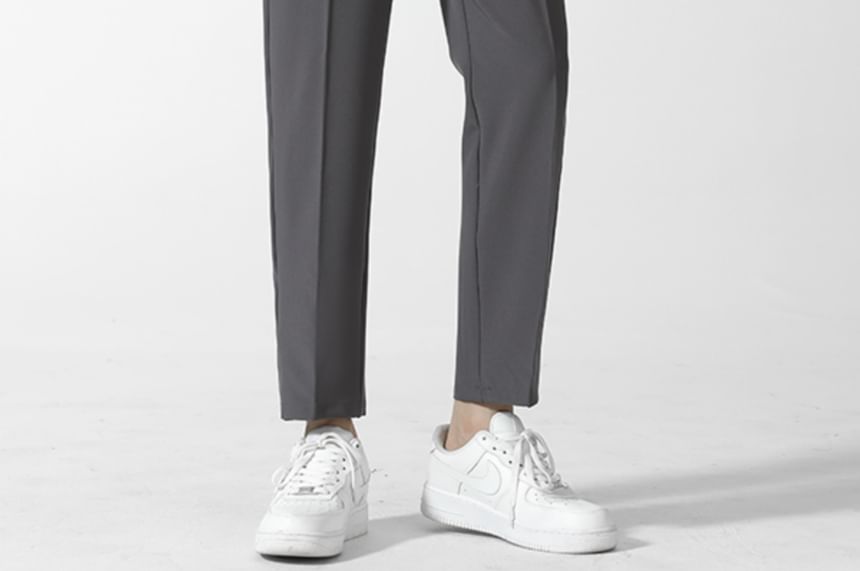 Loansk - Effen cropped, taps toelopende broek met trekkoord in de taille
