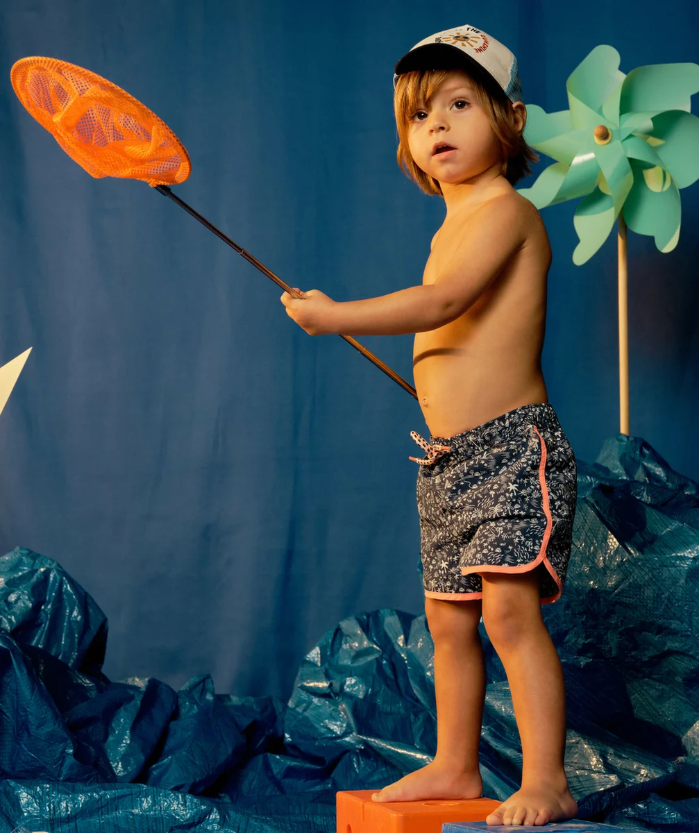 LE SHORT DE BAIN BLEU IMPRIMÉ PALMIERS AVEC DETAILS ORANGE
