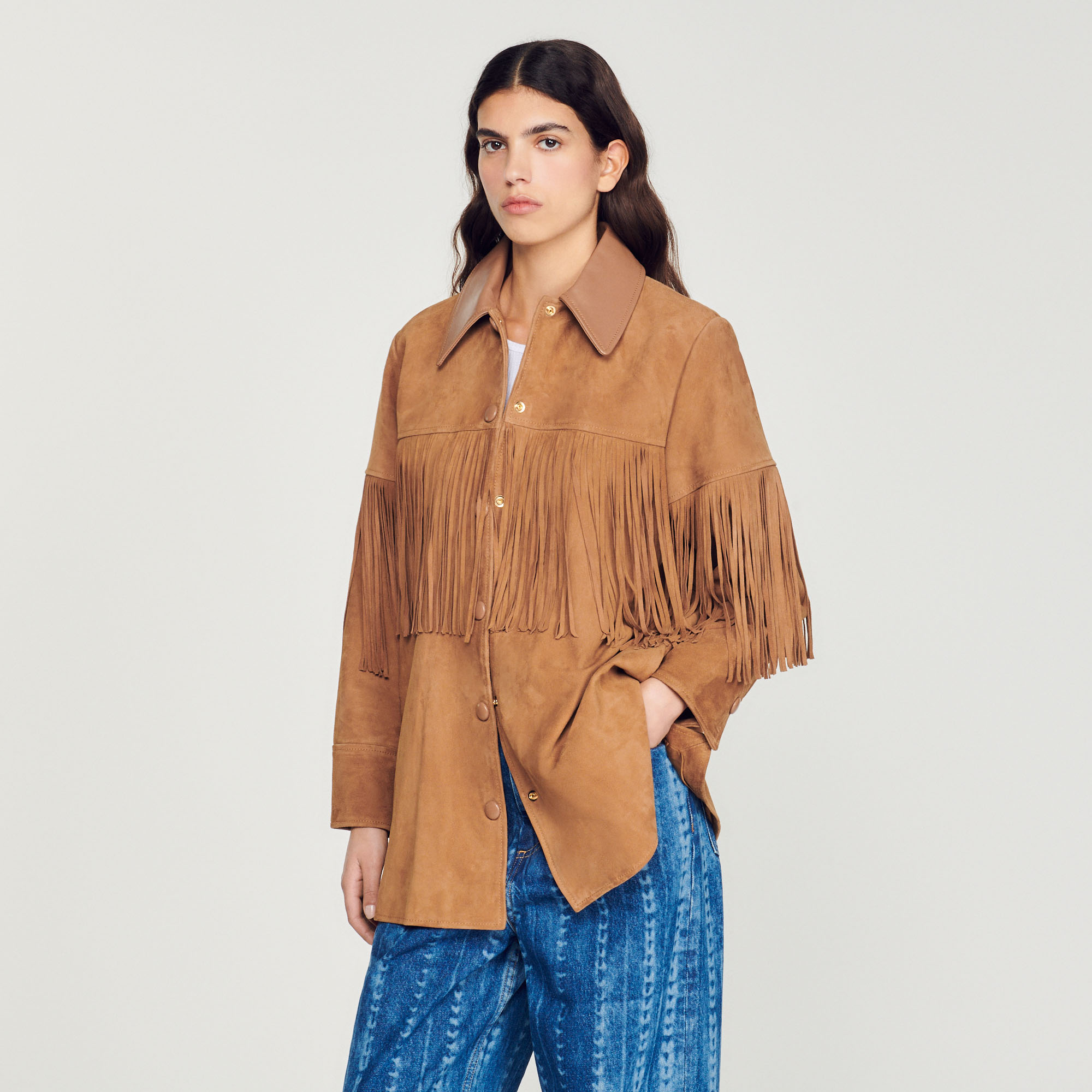 Veste longue en cuir á franges