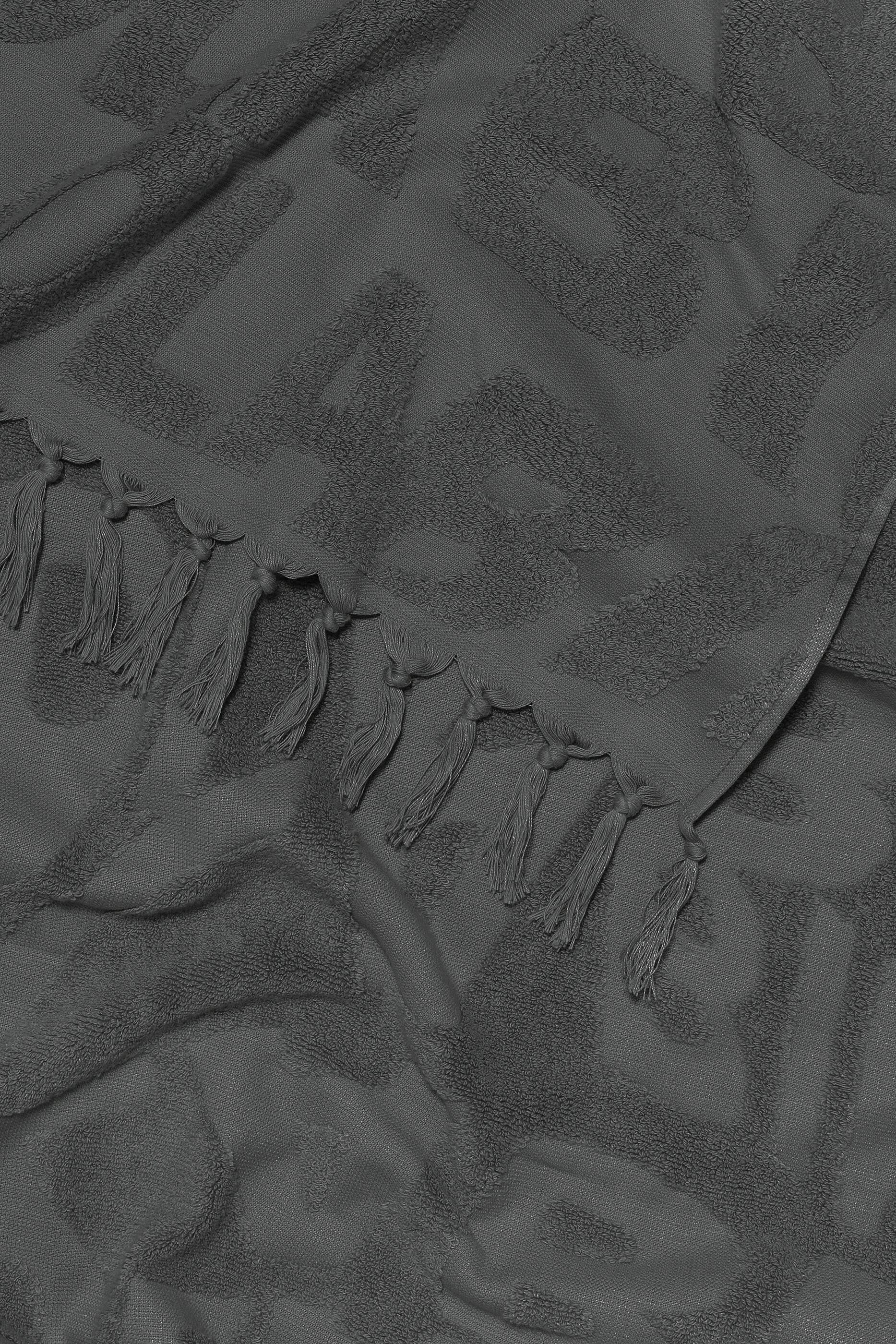 Toalha preta com logo em jacquard