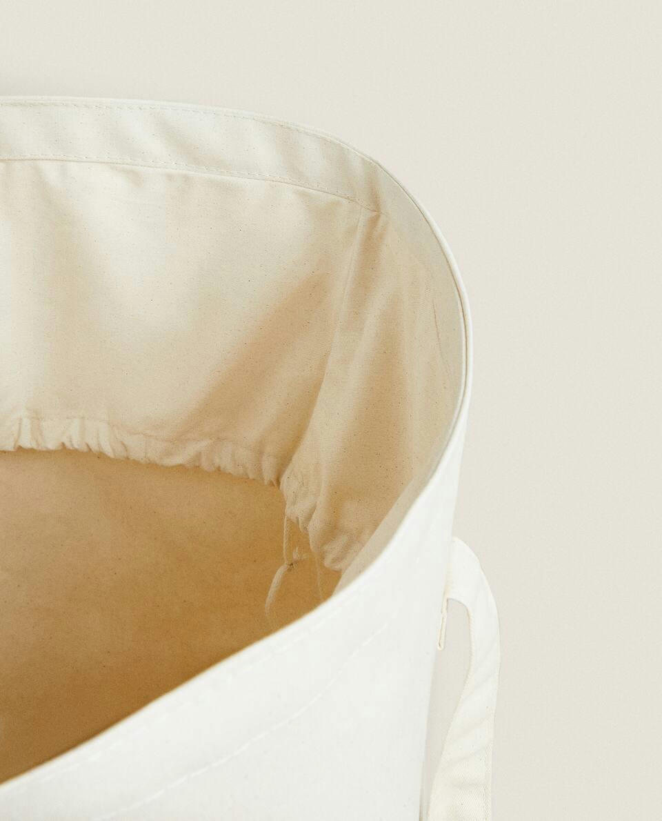 Cesto de roupa redondo com alças