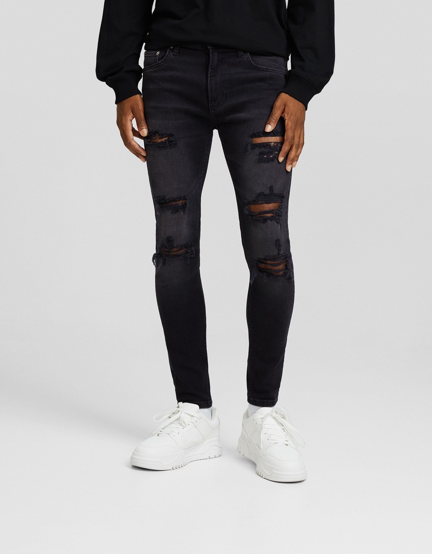 calça jeans super skinny rasgada