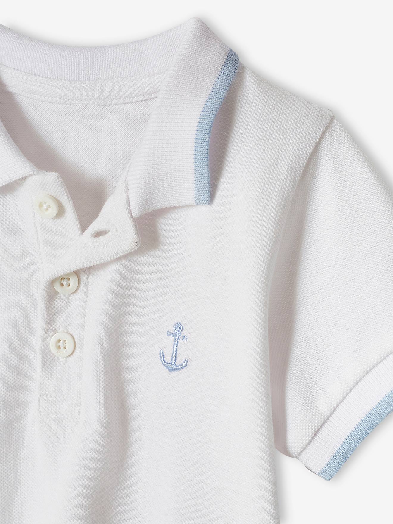 Camisa polo personalizável para bebê menino com bordado liso azul escuro no peito.