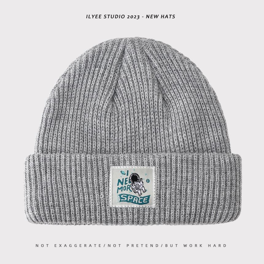 Uweiifame - Effen muts met appliqué