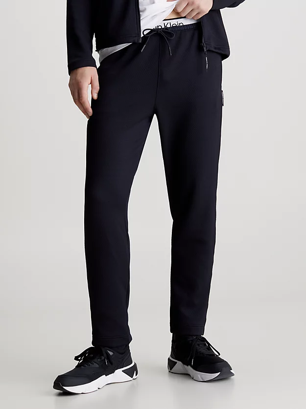 Calça jogger jacquard com cós duplo.