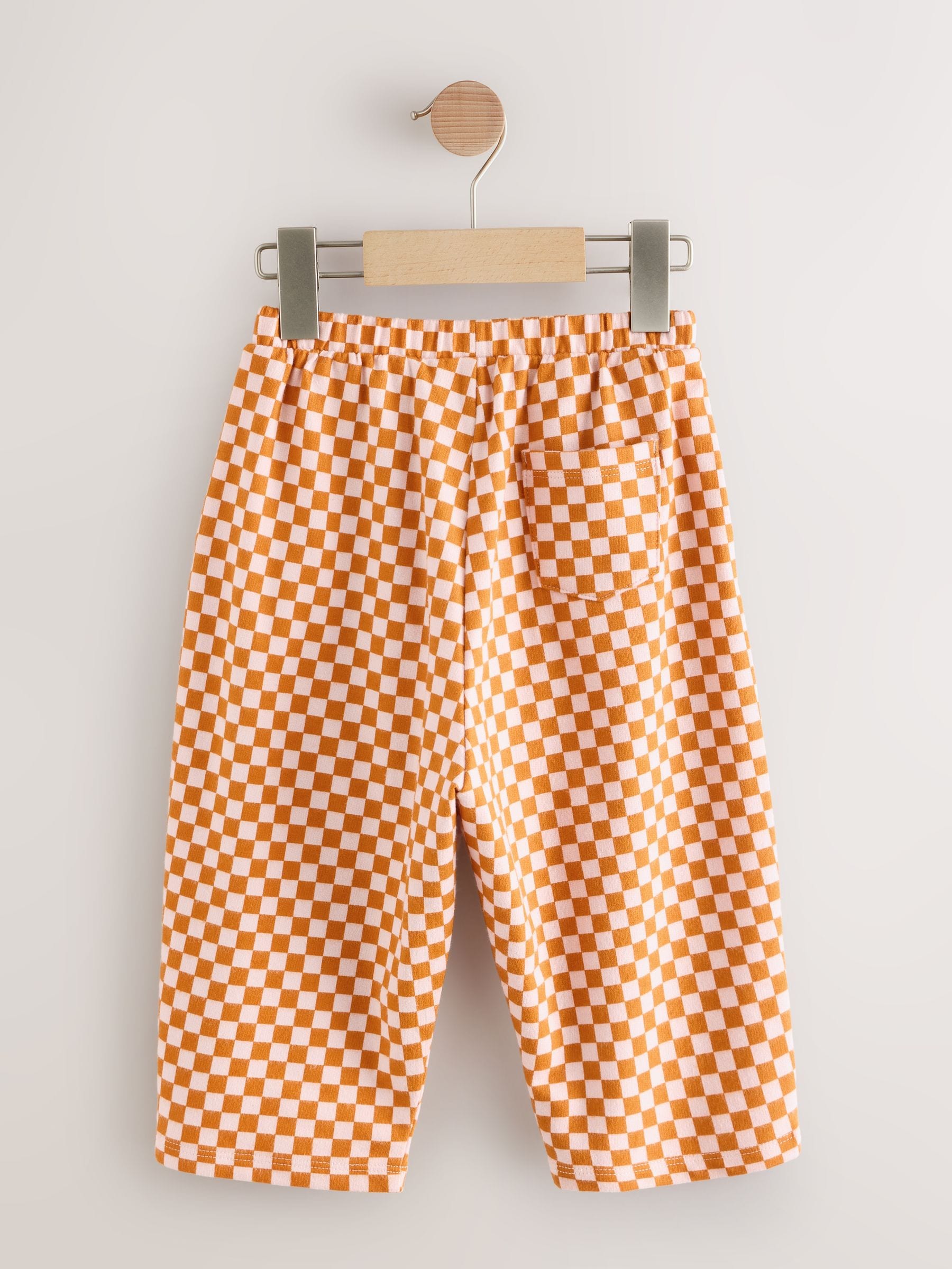 Oranje met dambordmotief - Broek met wijde kortere pijpen (3mnd -7jr)
