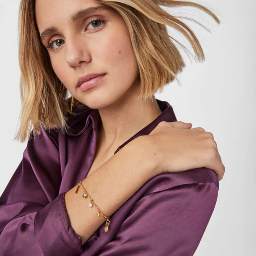 Pulseira com banho de ouro 18k sobre prata, diamantes e pérolas com 5 motivos noturnos.