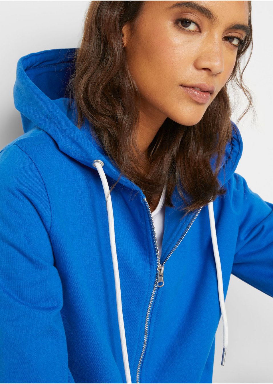 Gilet sweat à capuche avec poches latérales