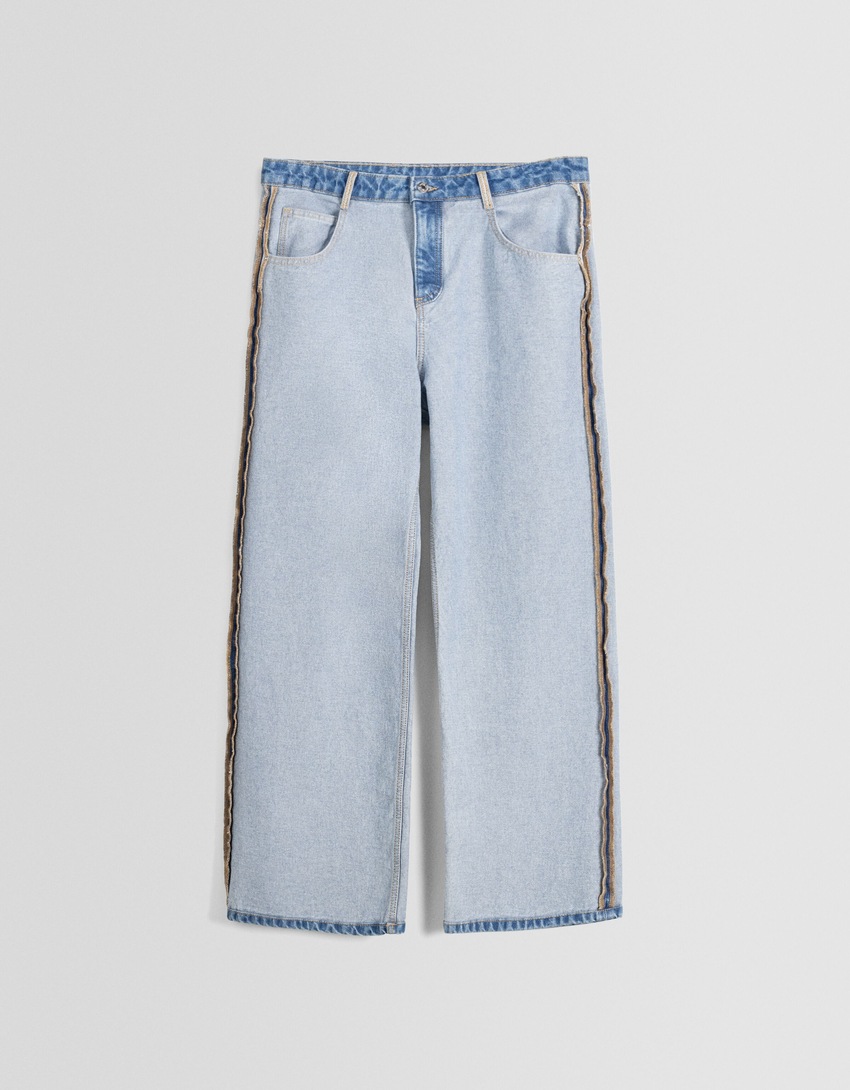 calças jeans largas ao contrário