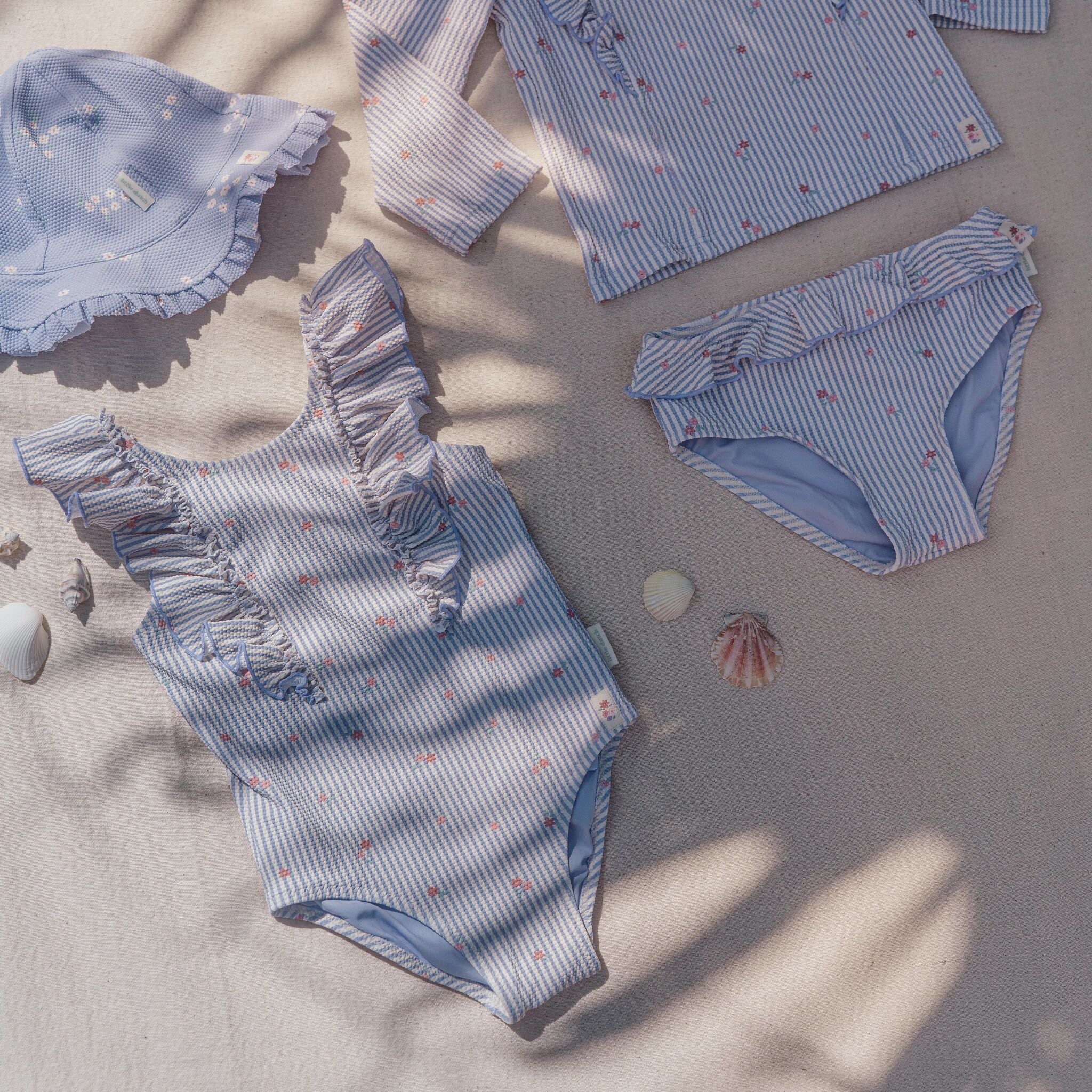 Lila badpak met ruches en drukknoopjes – zomers & comfortabel