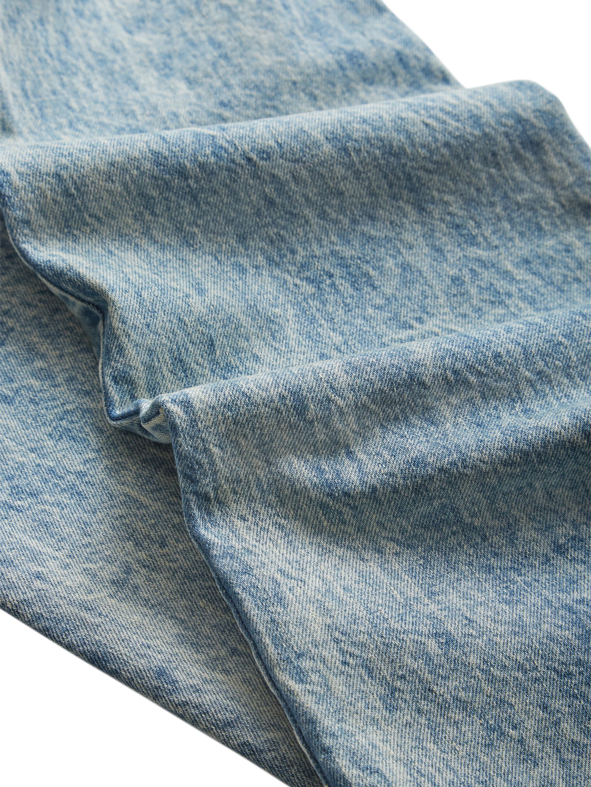 calça jeans de cintura baixa com ilhós